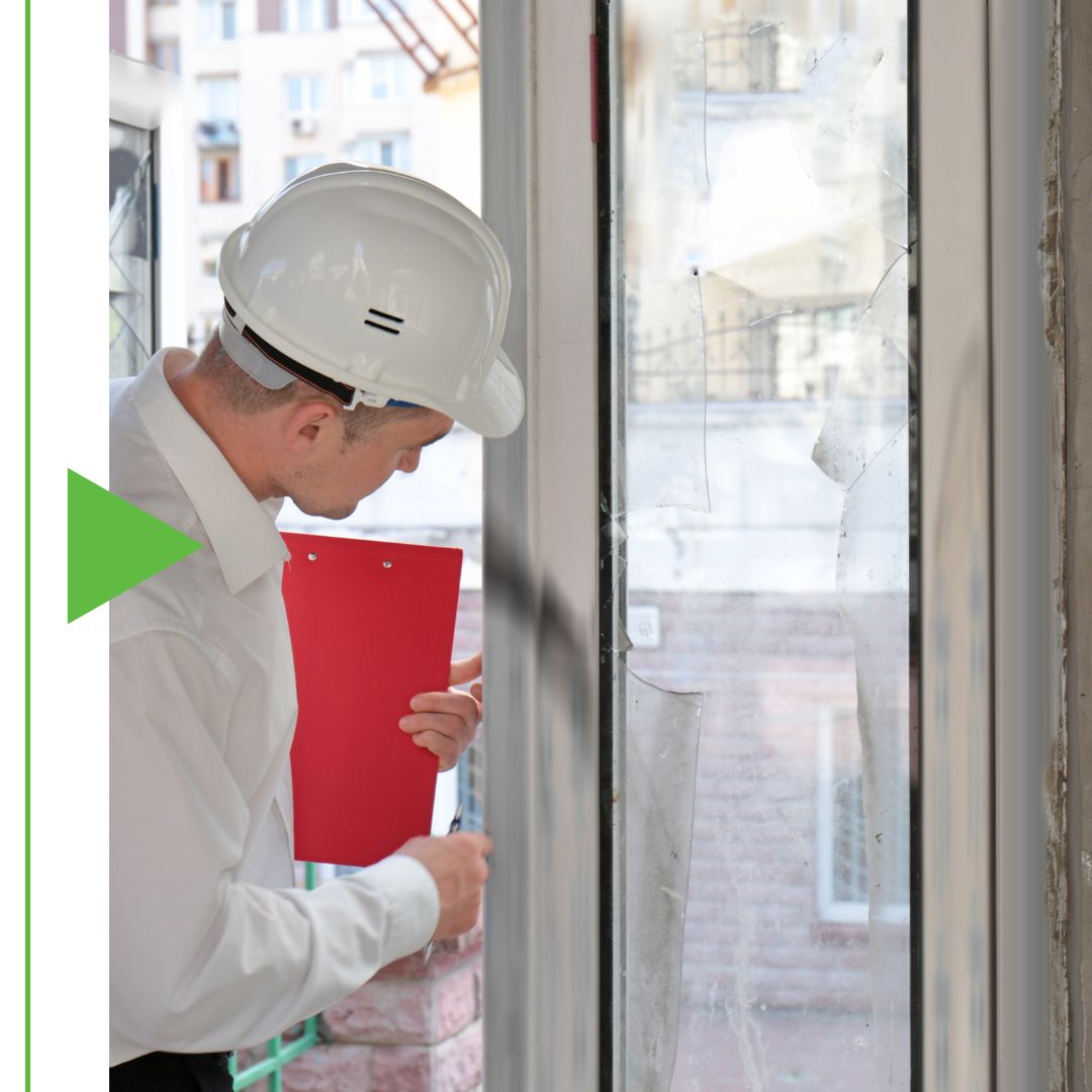 Image of a man inspecting a house