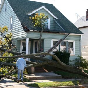 man assessing storm damage